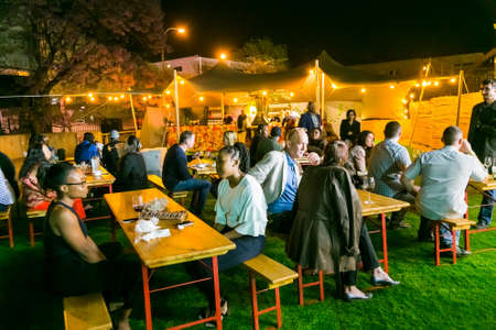 Johannesburg, South Africa - October 12 2017: Diverse Friends eating, drinking and generally enjoying a day out at a Food and Wine Fairのeditorial素材