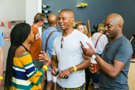 Johannesburg, South Africa - October 15 2016: African Friends eating, drinking and generally enjoying a day out at a Food and Wine Fairのeditorial素材