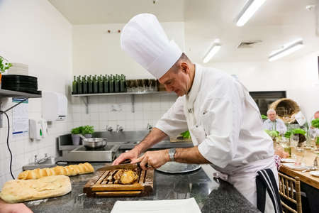 Johannesburg, South Africa - October 3, 2014: Pastry Chef preparing a gourmet chocolate dessert dishのeditorial素材