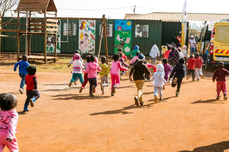 Soweto, South Africa - July 18, 2016: Young African Preschool kids playing in the playground of a kindergarten schoolのeditorial素材