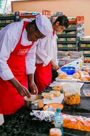 Soweto, South Africa - September 17, 2017: Diverse African vendors cooking and serving various bread based street food at outdoor festivalのeditorial素材