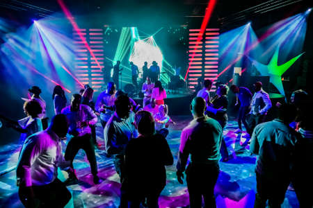 Johannesburg, South Africa - April 13, 2016: Group of people dancing on a dance floor in dark night club environmentのeditorial素材