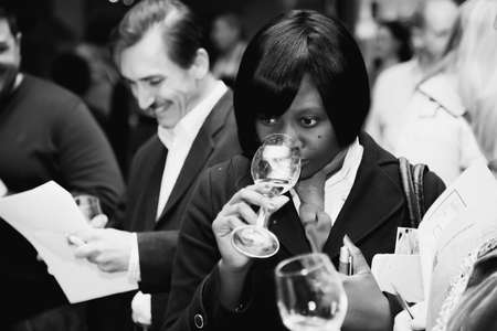 Johannesburg, South Africa - May 17, 2012: Diverse people at wine tasting eventのeditorial素材