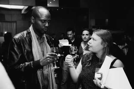 Johannesburg, South Africa - May 17, 2012: Diverse people at wine tasting eventのeditorial素材