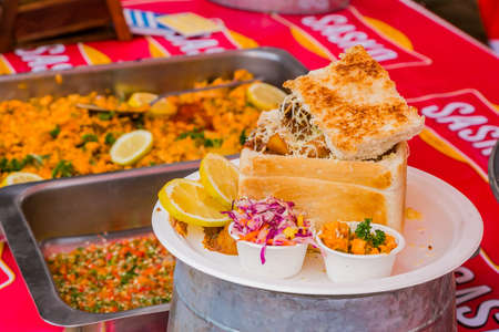 Soweto, South Africa - September 17, 2017: Close up of Traditional African bread based street food...