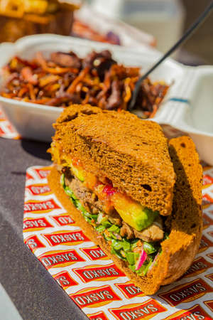 Soweto, South Africa - September 8, 2018: Close up of Traditional African bread based street food...