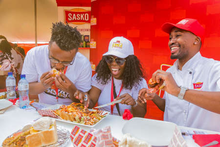 Soweto, South Africa - September 17, 2017: Diverse African judges tasing and scoring meals at...