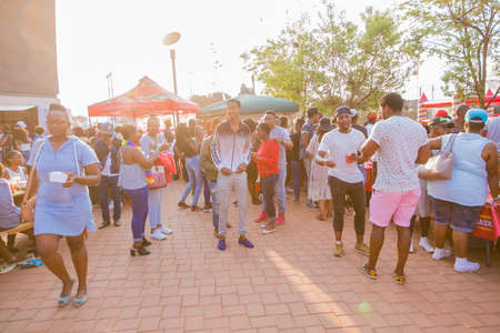 Soweto, South Africa - September 17, 2017: Diverse African people at a bread based street food outdoor festivalのeditorial素材