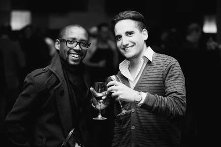 Johannesburg, South Africa - May 17, 2012: Diverse people at wine tasting eventのeditorial素材