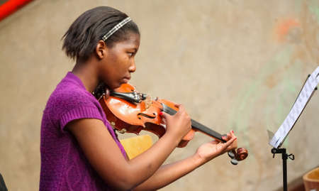 Johannesburg, South Africa - August 28 2010: Diverse youth at music school orchestraのeditorial素材
