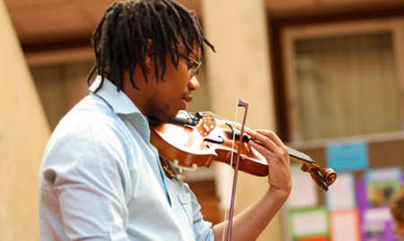 Johannesburg, South Africa - August 28 2010: Diverse youth at music school orchestraのeditorial素材