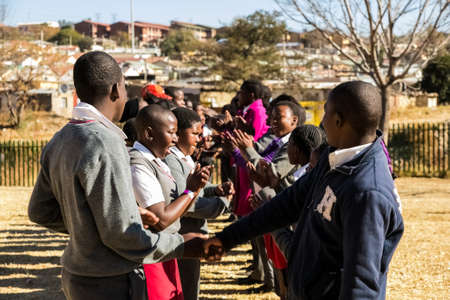 Johannesburg, South Africa - June 19, 2014: Diverse African high school pupils playing physical...