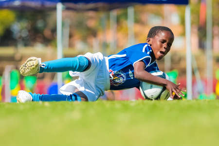 Johannesburg, South Africa - June 29 2009:  Diverse children playing soccer football at schoolのeditorial素材