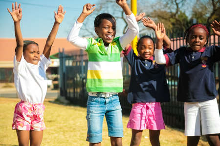 Pretoria, South Africa - August 26 2009: Diverse African Primary School children doing physical exercise PT lessonのeditorial素材