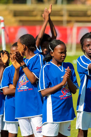 Johannesburg, South Africa - June 29 2009:  Diverse children playing soccer football at schoolのeditorial素材