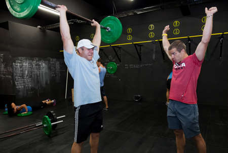 Johannesburg, South Africa - March 11, 2013: Personal Trainer giving fitness instruction at a Crossfit group classのeditorial素材