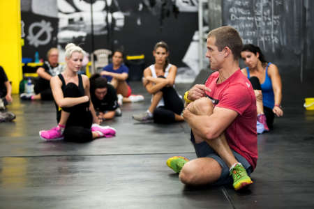 Johannesburg, South Africa - March 11, 2013: Personal Trainer giving fitness instruction at a Crossfit group classのeditorial素材