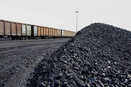 processed coal piles next to railway sidingの写真素材