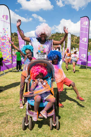 Soweto, South Africa, April 17, 2017, Diverse people running in The Color Run Marathon in Soweto