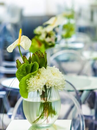 White flowers on a table setting for event or party with lilliesの写真素材