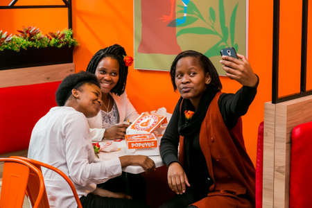 Johannesburg, South Africa - July 13 2017: Customers at a Popeyes Take Out Fast Food Restaurantのeditorial素材