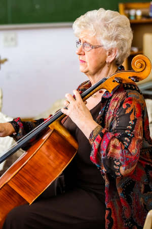 Johannesburg, South Africa - August 28 2010: Teacher at music school orchestra classのeditorial素材