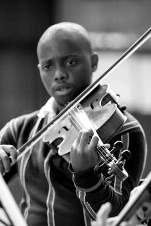 Johannesburg, South Africa - August 28 2010: Diverse youth at music school orchestraのeditorial素材