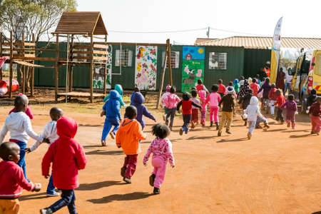 Soweto, South Africa - July 18, 2016: Young African Preschool kids playing in the playground of a kindergarten schoolのeditorial素材