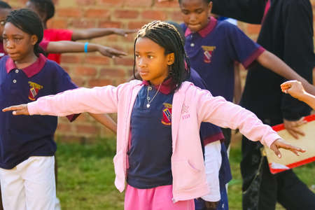 Pretoria, South Africa - August 26 2009: Diverse African Primary School children doing physical exercise PT lessonのeditorial素材