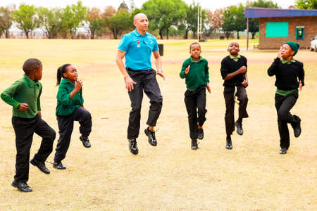 Johannesburg, South Africa - October 14 2010: Diverse African Primary School children doing physical...