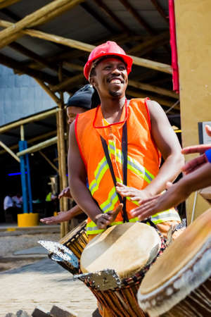 Johannesburg, South Africa, April 24, 2013, African Men playing traditional drums for Soweto township touristsのeditorial素材