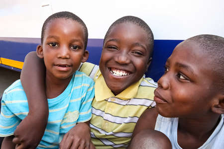 Soweto, South Africa - September 11, 2009: Three young African boys displaying friendship and joy in a Soweto Townshipのeditorial素材