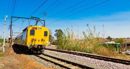 Soweto, South Africa - September 08 2018: Commuter Train moving through the heart of Soweto, Johannesburgのeditorial素材