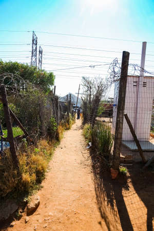 Johannesburg, South Africa, September 11, 2011, Back Ally dirt road path in suburban Soweto neighborhoodのeditorial素材