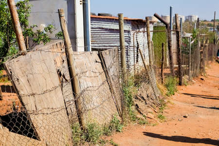 Johannesburg, South Africa, September 11, 2011, Back Ally dirt road path in suburban Soweto neighborhoodのeditorial素材