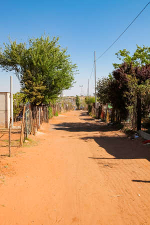 Johannesburg, South Africa, September 11, 2011, Back Ally dirt road path in suburban Soweto neighborhoodのeditorial素材