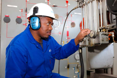 Johannesburg, South Africa - April 11 2012: Electrical Engineer checking gauge equipmentのeditorial素材