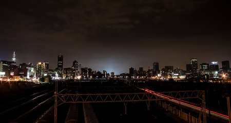 Johannesburg, South Africa - March 26, 2011: Night time view of commuter trains under Nelson Mandela Bridge in Braamfontein Johannesburg CBDのeditorial素材