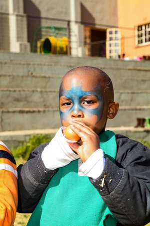 Soweto, South Africa - July 18, 2012: Young African Preschool children doing an egg and spoon race on the playgroundのeditorial素材