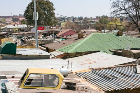 Johannesburg, South Africa - August 29 2013: High Angle rooftop view of low income houses in Alexandra township Johannesburg South Africaのeditorial素材