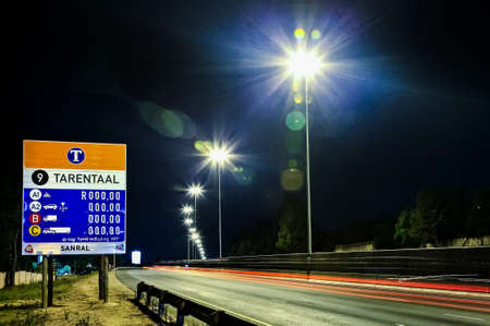 Johannesburg, South Africa - October 24 2011: Motorway Signs on Highway at nightのeditorial素材
