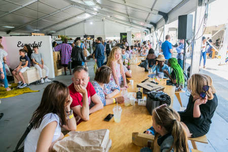 Johannesburg, South Africa - October 14 2017: Diverse Friends eating, drinking and generally...