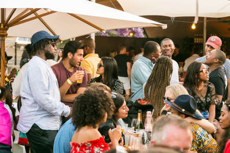 Johannesburg, South Africa - October 14 2017: Diverse Friends eating, drinking and generally enjoying a day out at a Food and Wine Fairのeditorial素材
