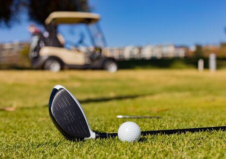 Golf Clubs and Balls on a Golf Course Fairway on a sunny dayの写真素材