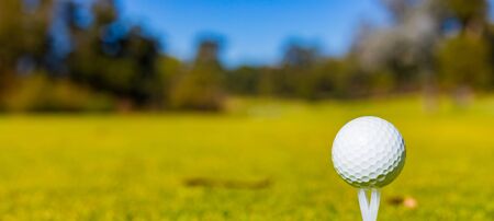 Macro Close up of a Golf Ball on a Tee at a Golf Courseの写真素材