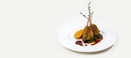 Lamb Ribs on a white plate on a white background isolatedの写真素材