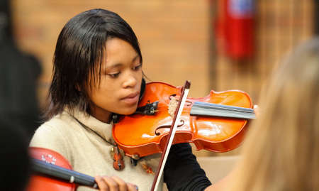 Johannesburg, South Africa - August 28 2010: Diverse youth at music school orchestraのeditorial素材