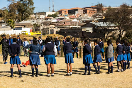 Johannesburg, South Africa - June 19, 2014: Diverse African high school pupils playing physical games on the sports fieldのeditorial素材