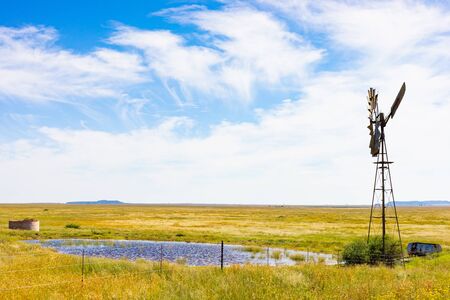 Windmill Windpump on a farm in rural grassland area of South Africa
