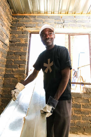 Soweto, South Africa - September 05, 2009: Community Outreach program helping to build a small...